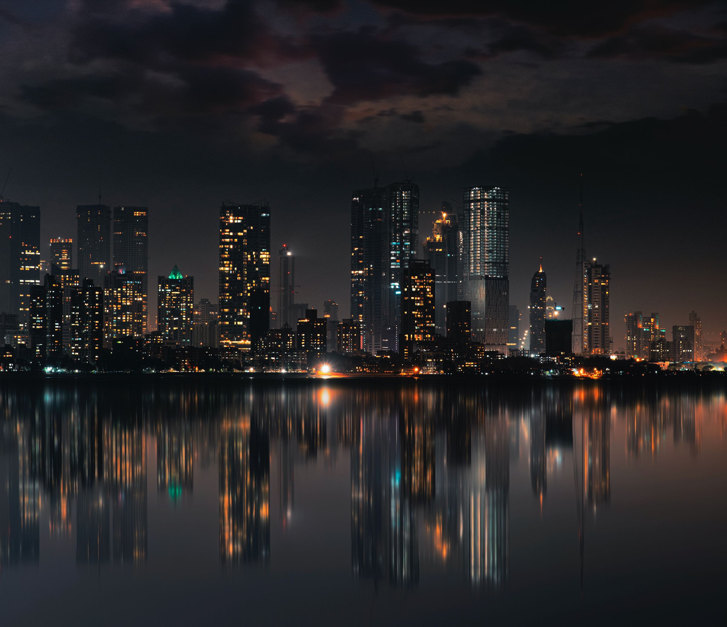 City skyline reflected in water at dusk